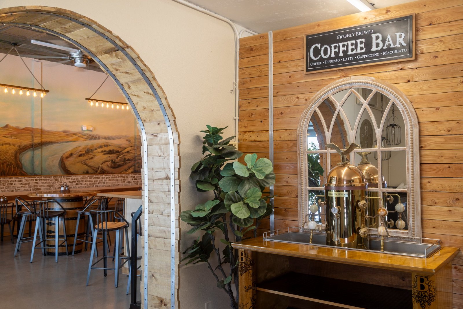 Wood arch seating nook inside Barrels & Bean